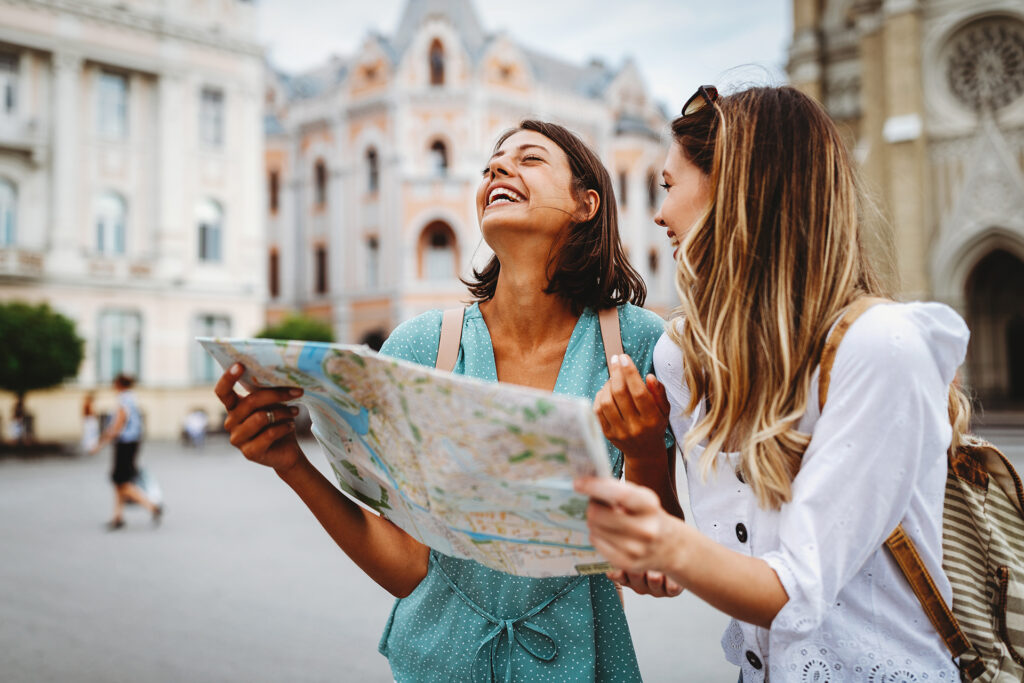 girls in Europe looking at a map