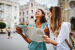 girls in Europe looking at a map