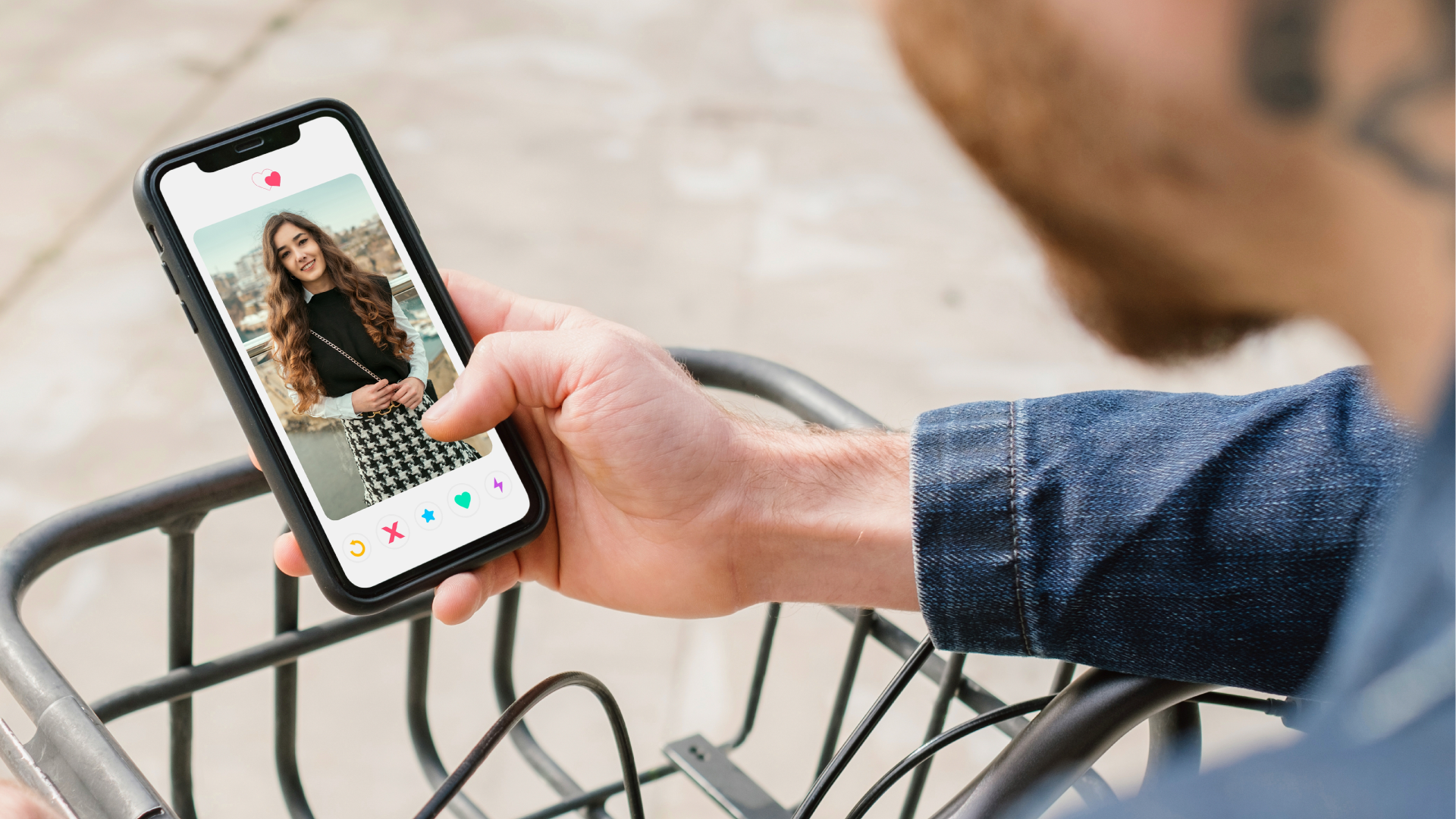 Man looking at dating app on phone.