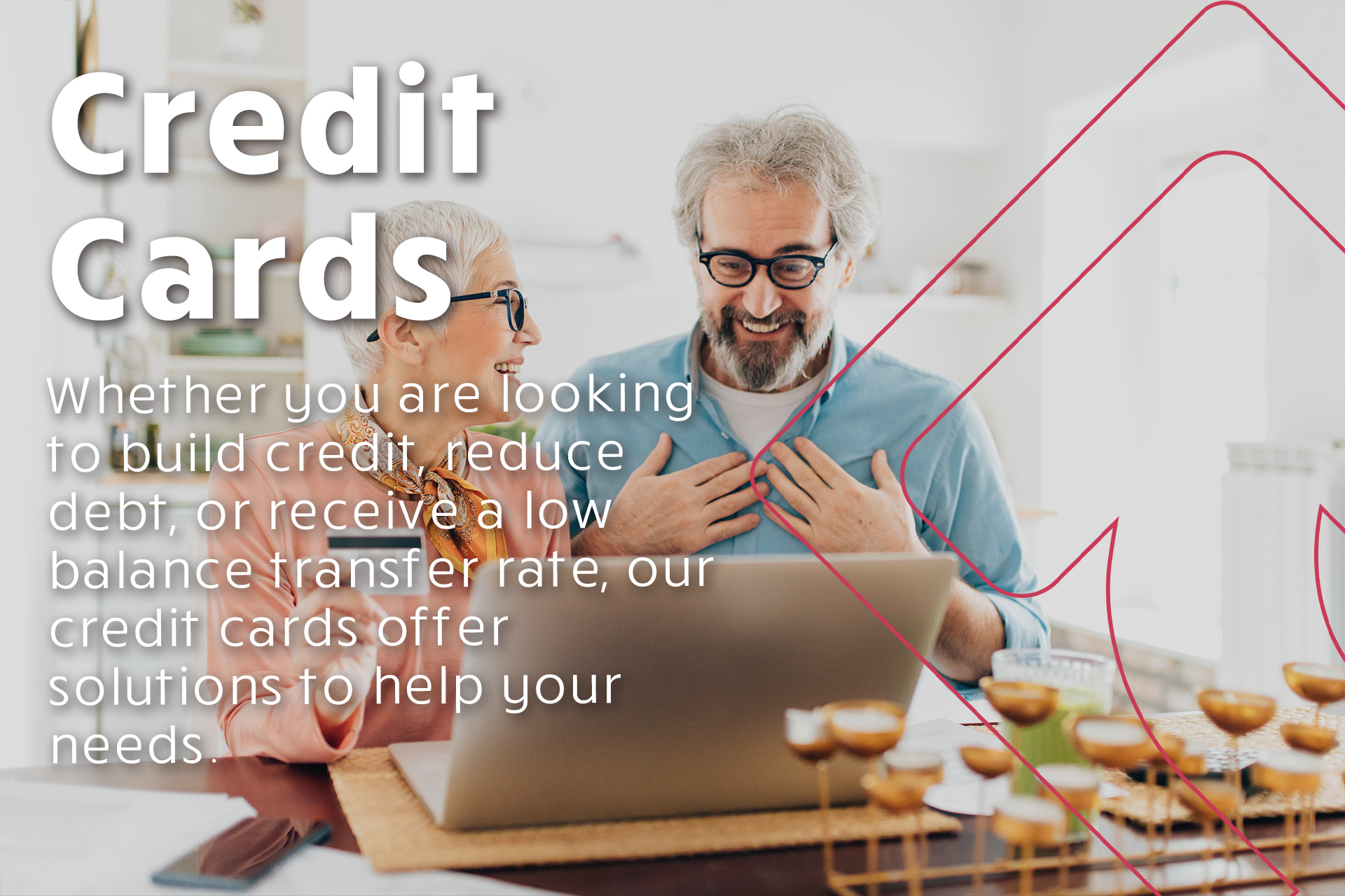 man and wife looking excited at laptop