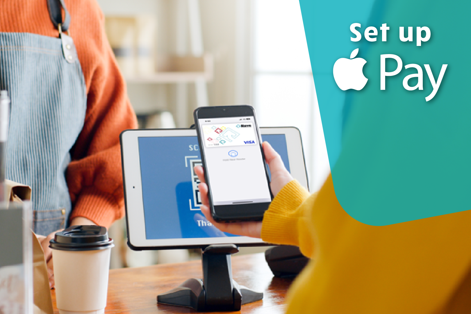 Image of a person using their phone to pay at a counter. How to set up Apple Pay.