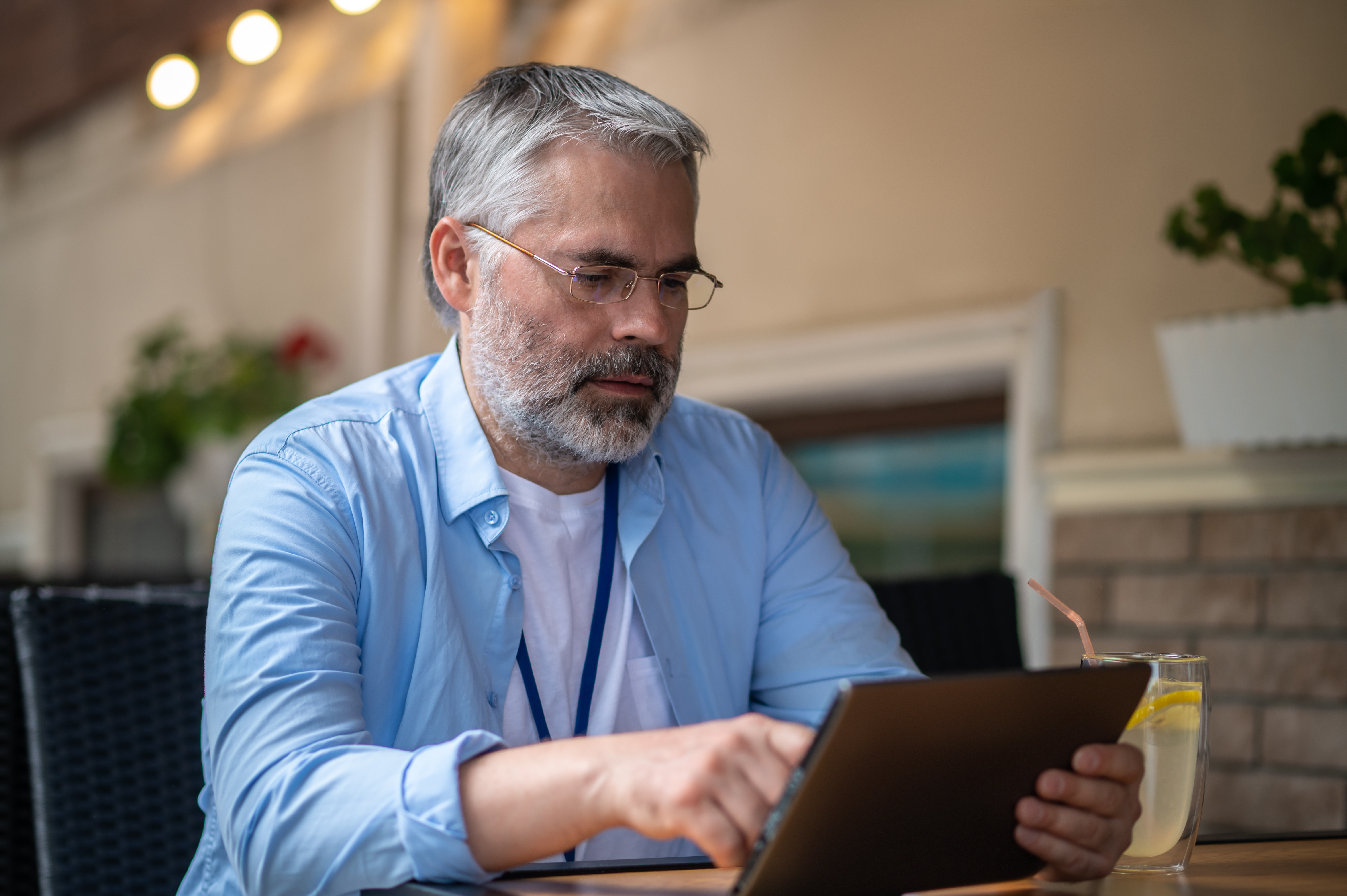 Older man looking at ipad