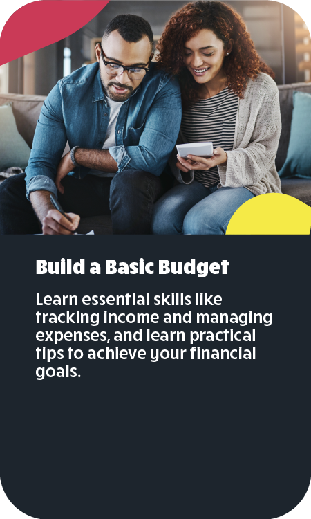 Middle-aged couple sitting on sofa reading and writing together as they create a budget.