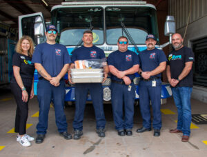 Rave Financial employees donate food to the Willis Fire Department