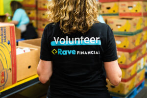 Woman wearing Rave Financial Volunteer shirt