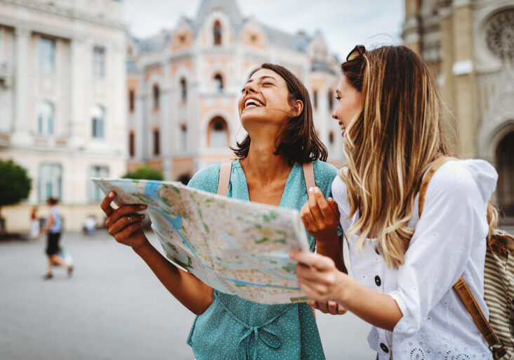 girls in Europe looking at a map