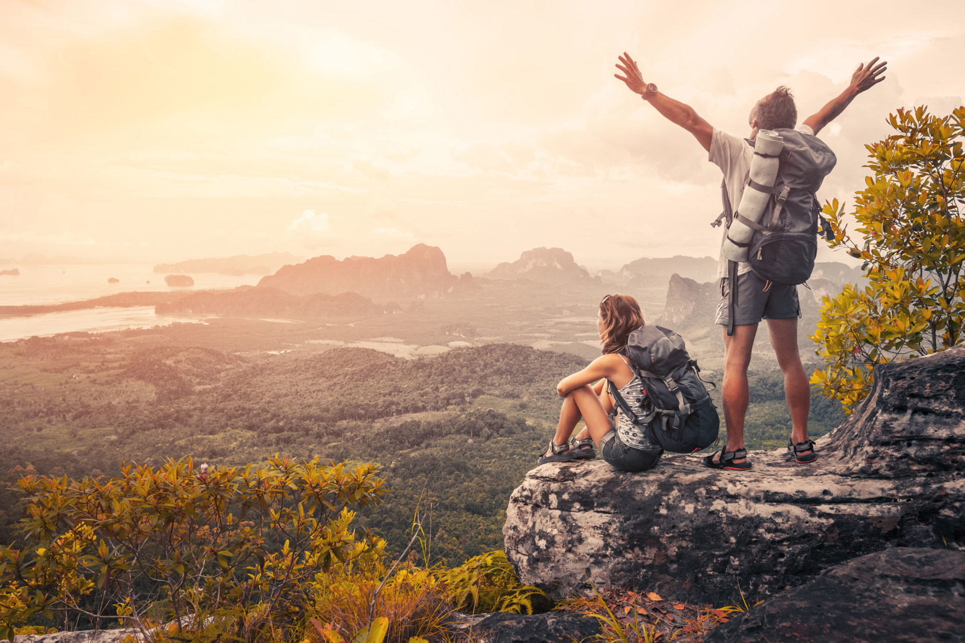 couple hiking on cliff
