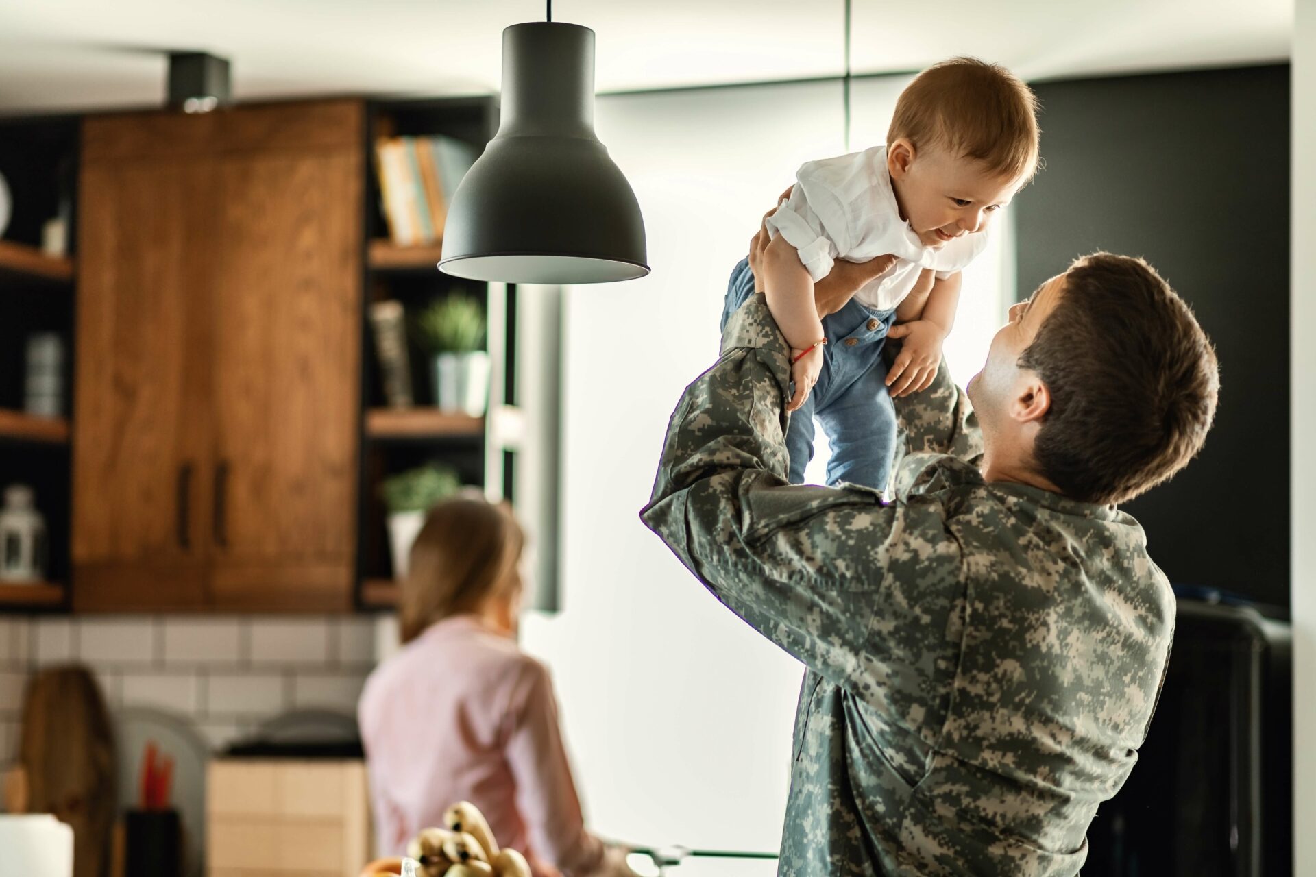 veteran dad holding baby