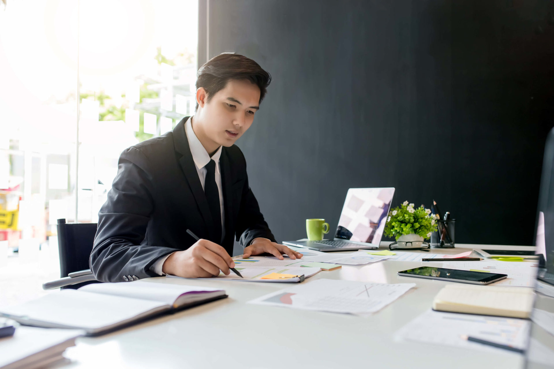 business man at office reviewing paperwork