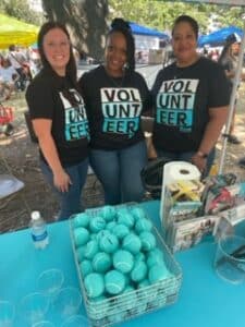 Rave Financial Credit Union employees volunteer at Dogtoberfest in Beaumont, Texas.