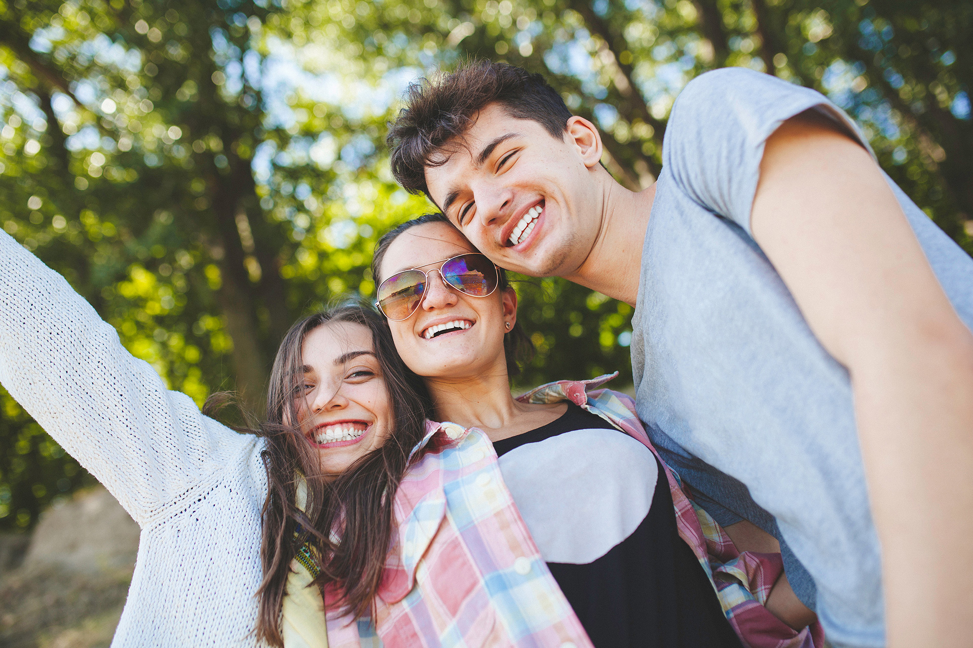 mom with two young kids smiling